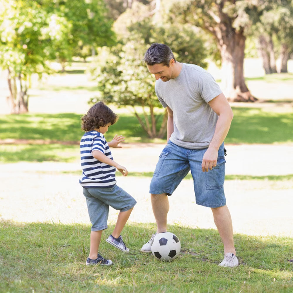 Father & Child playing with football